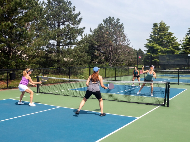 Two people playing pickleball