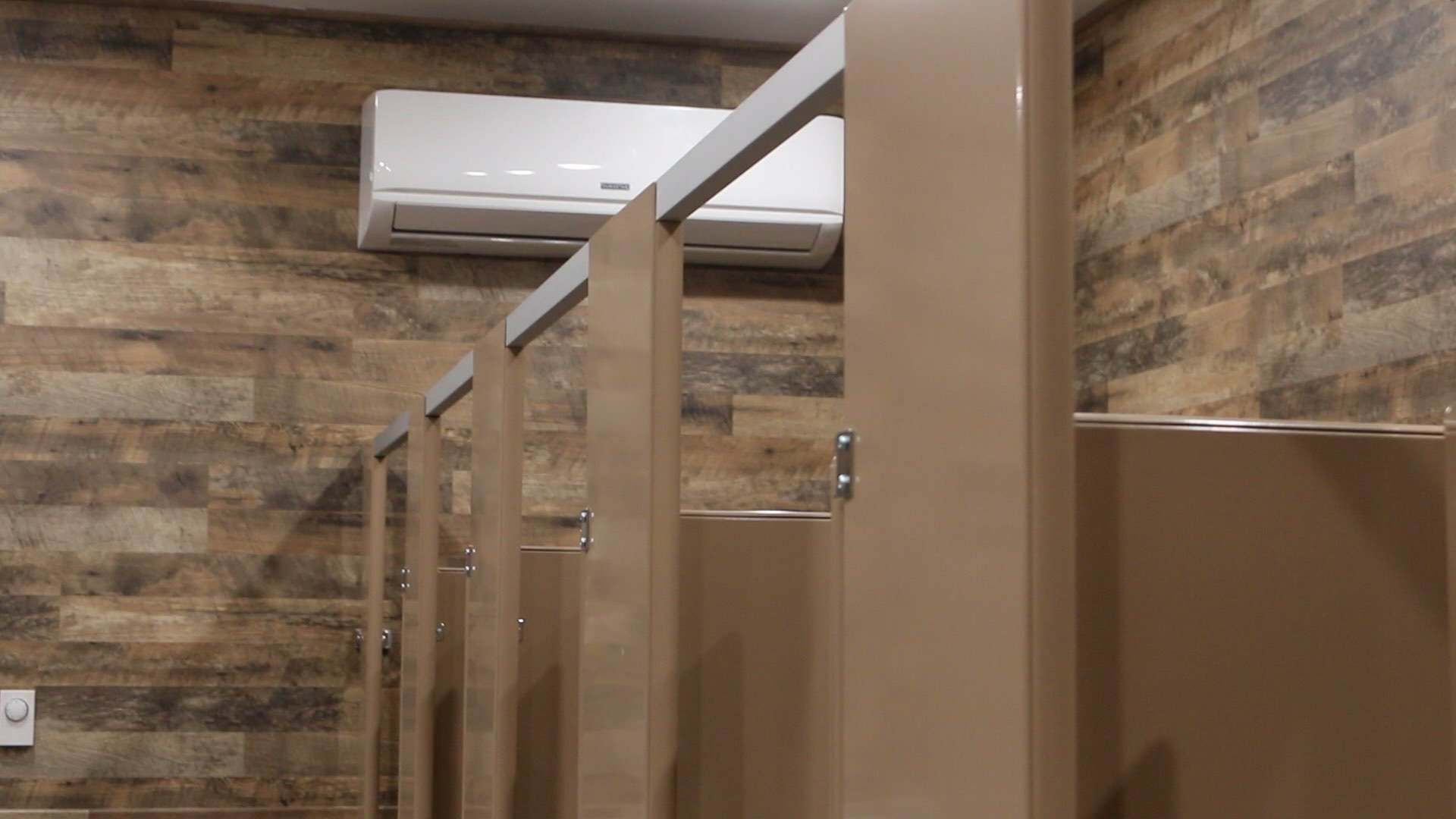 A row of stalls in a bathroom