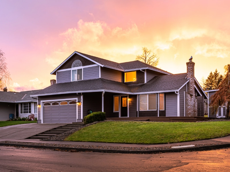 A house in front of a sunset